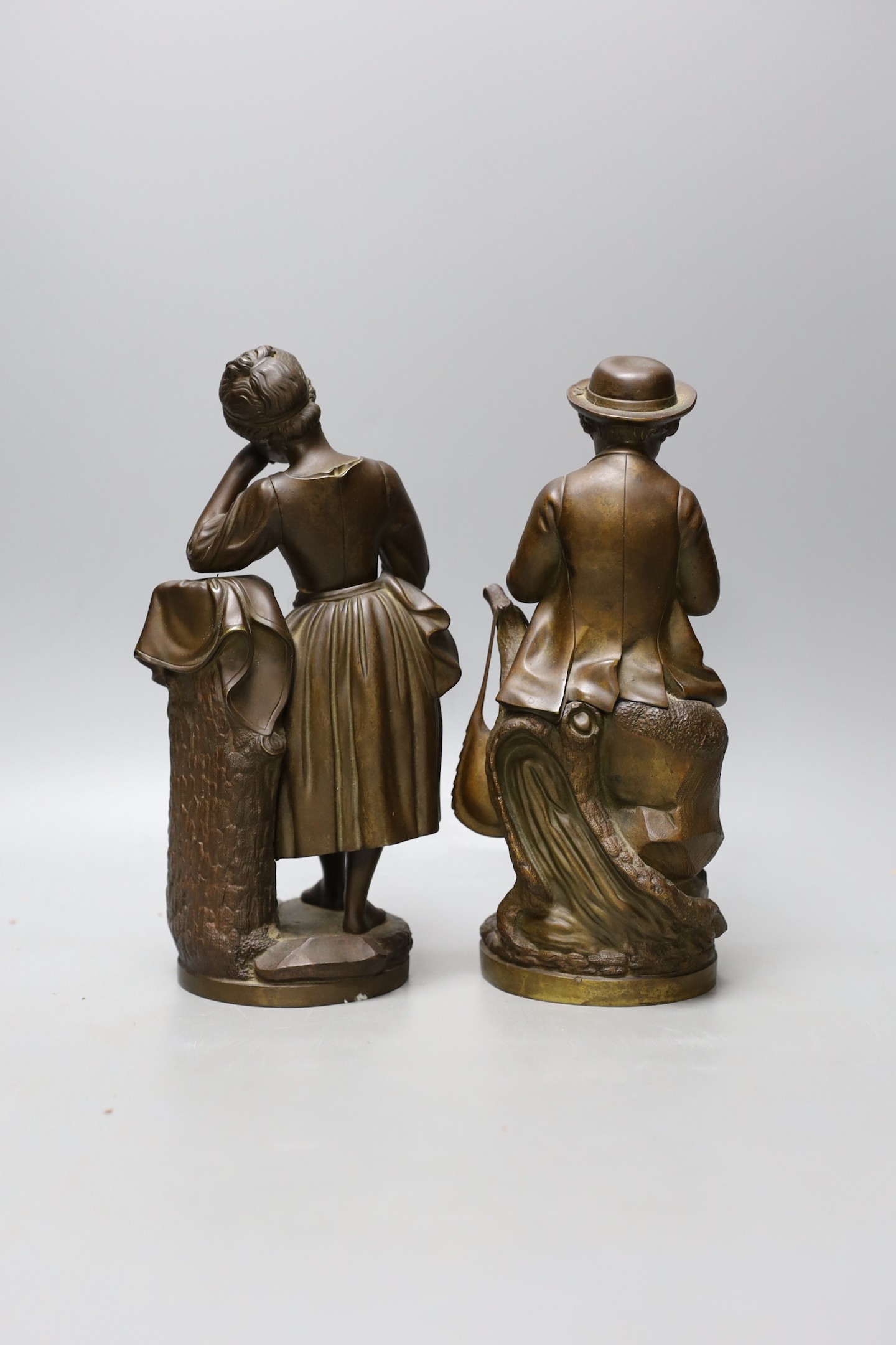 A pair of 19th century bronze figures of children, 24cm